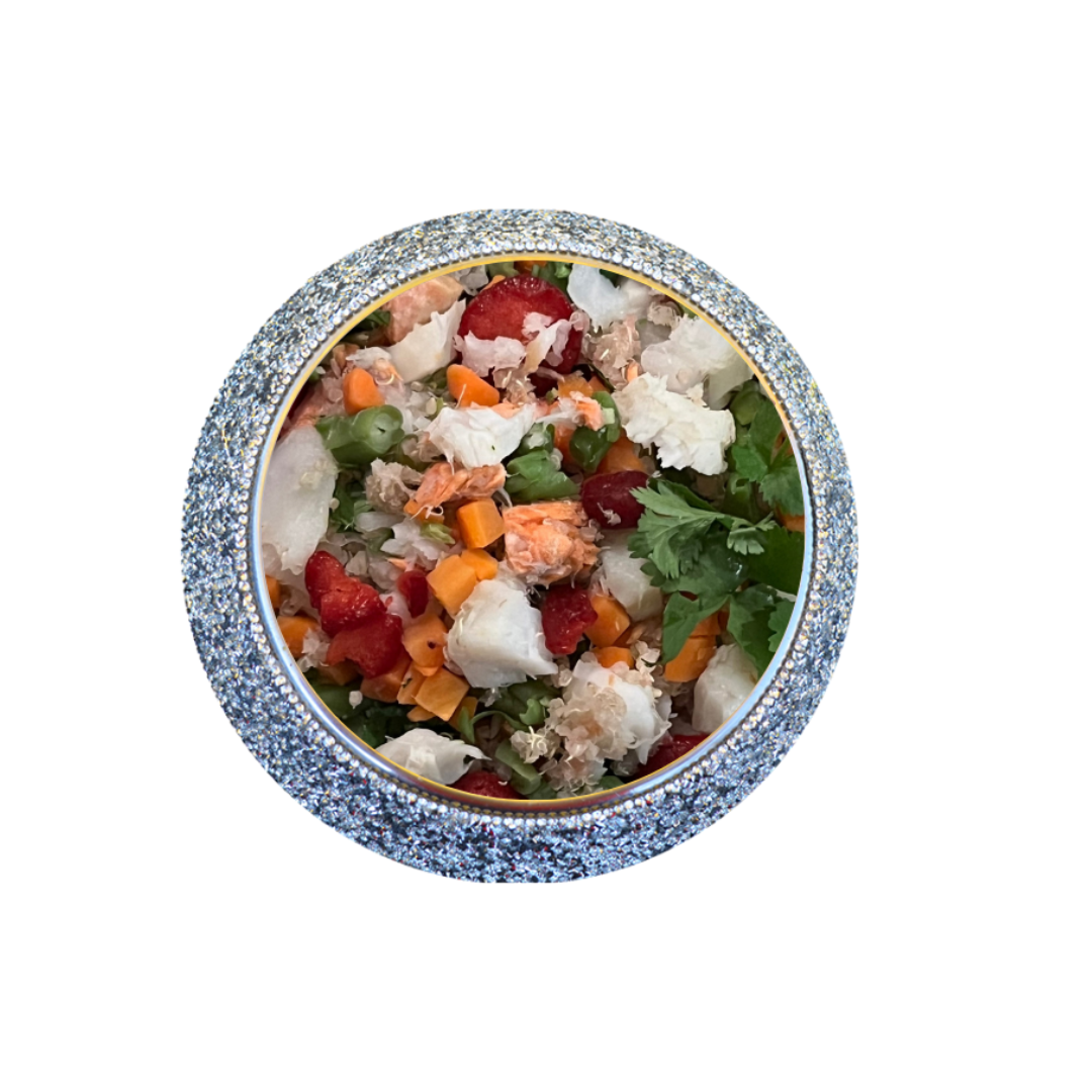 Bowl of Rocker Dog’s gently cooked wild caught salmon and pollock dog food with visible vegetables and herbs.