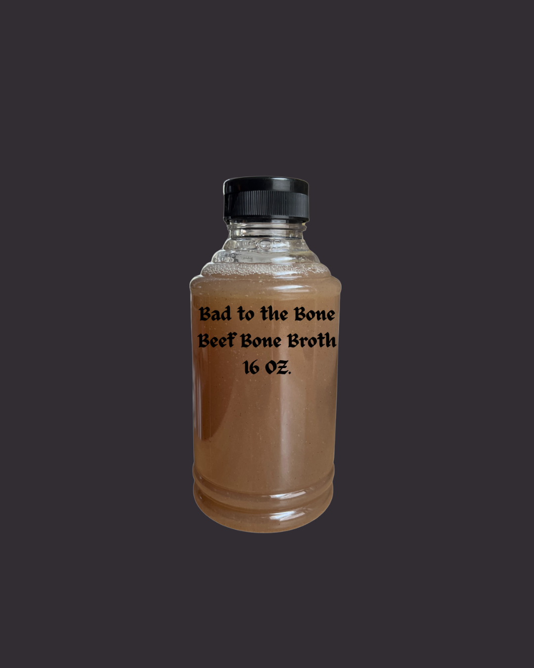Bad to the Bone 16 oz. plastic bottle of beef bone broth for dogs by Rocker Dog - an adaptogenic, small-batch supplement for digestion, hydration, and recovery.