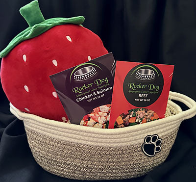 Rocker Dog Fan Club gift basket example consisting of 2 bags of Rocker Dog Adaptogenic Superfood, 1 plush pig dog toy, and a soft dog toy basket