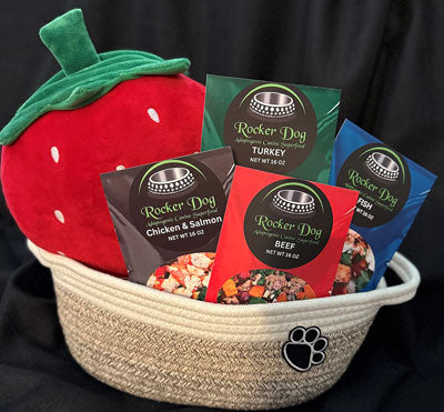 Rocker Dog Fan Club gift basket example consisting of 4 bags of Rocker Dog Adaptogenic Superfood, 1 plush pig dog toy, and a soft dog toy basket